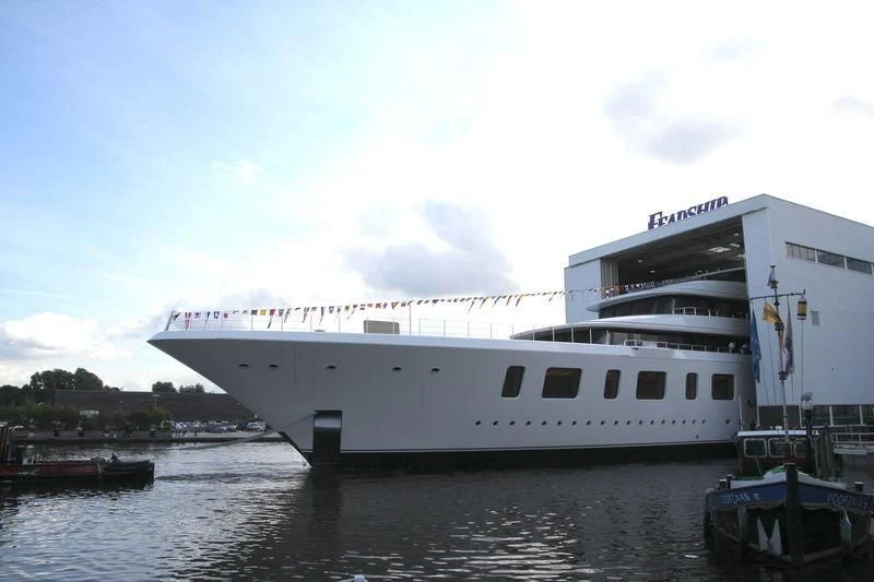 a boat docked at a pier aboard AQUARIUS Yacht for Sale