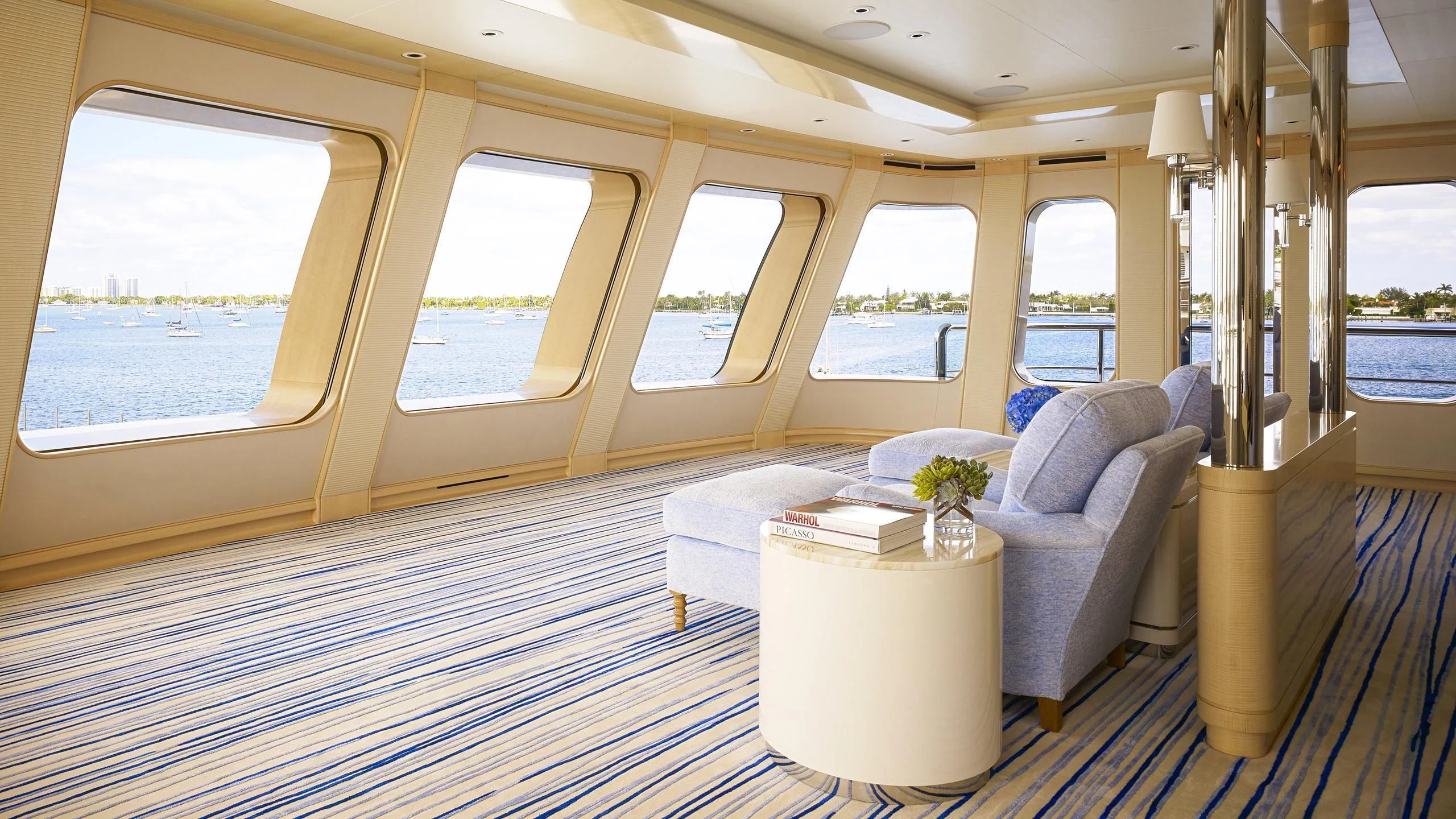 a living room with a large window aboard AQUARIUS Yacht for Sale