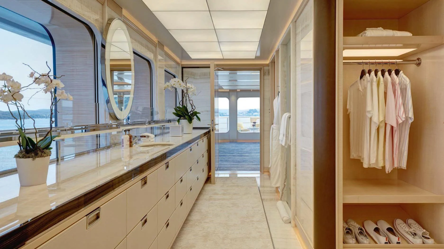 a bathroom with a countertop sink and a mirror aboard AQUARIUS Yacht for Sale