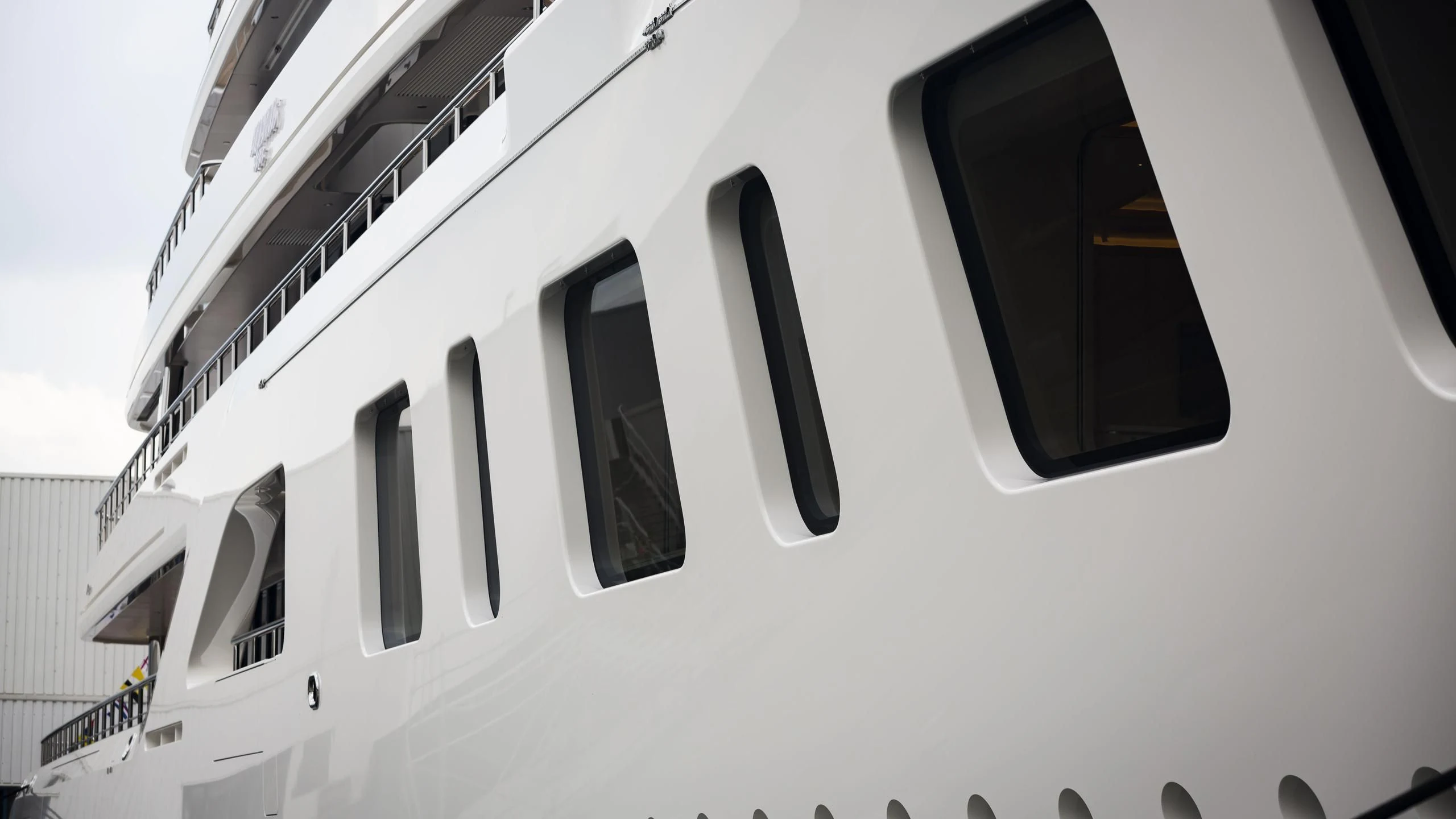 a white building with a black window aboard AQUARIUS Yacht for Sale