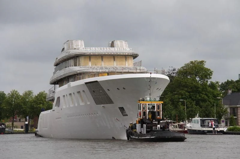 a large ship in the water aboard AQUARIUS Yacht for Sale
