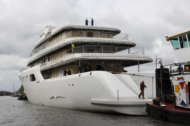 a large cruise ship docked aboard AQUARIUS Yacht for Sale