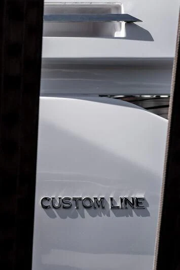a close-up of a white label on a black surface aboard NIMIR Yacht for Sale