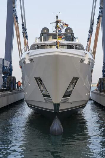 a large white boat in a harbor aboard NIMIR Yacht for Sale
