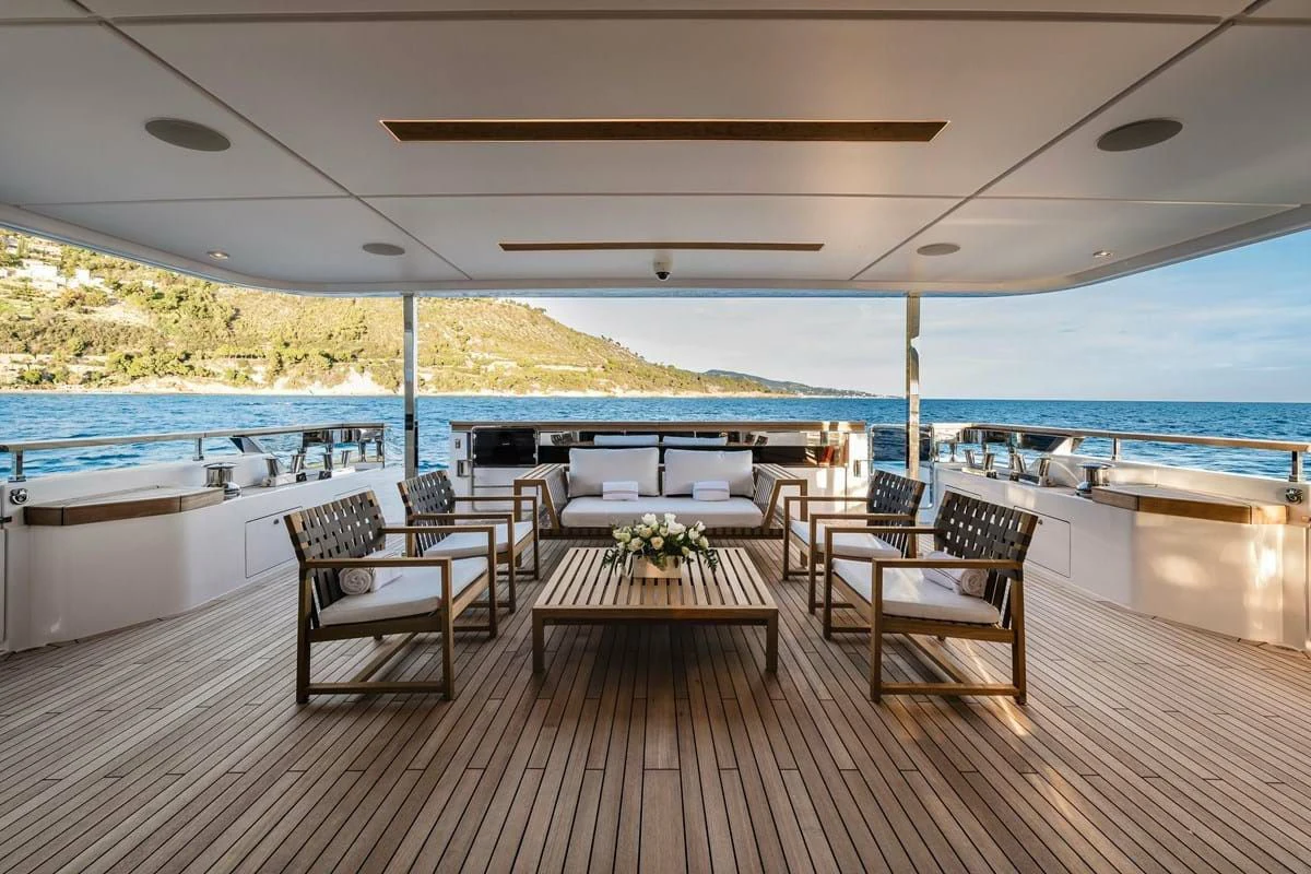 a room with a table and chairs aboard NIMIR Yacht for Sale