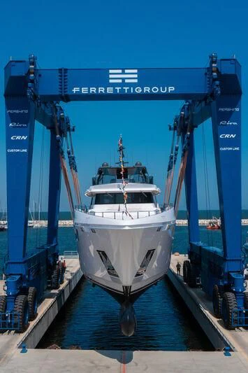 a white boat in a large blue container aboard NIMIR Yacht for Sale