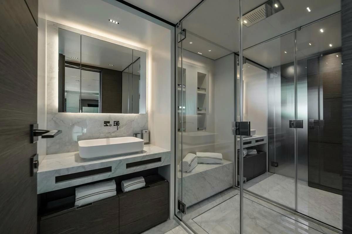 a bathroom with a large mirror aboard NIMIR Yacht for Sale