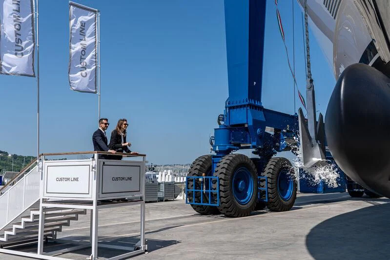 a couple of people sitting on a large blue machine aboard NIMIR Yacht for Sale