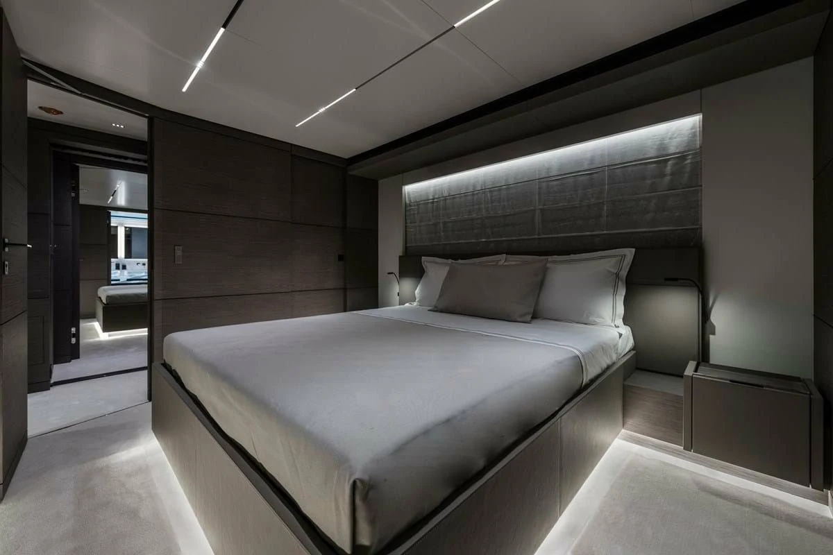 a large bed in a room aboard NIMIR Yacht for Sale