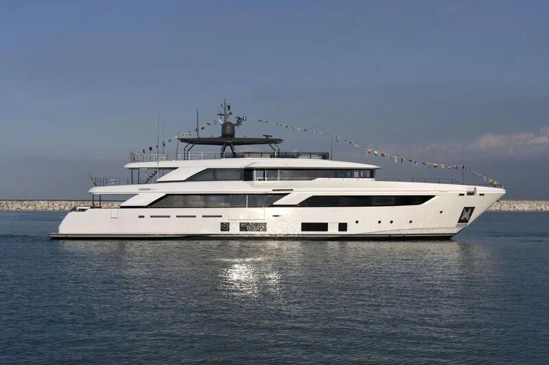 a large white boat on the water aboard NIMIR Yacht for Sale