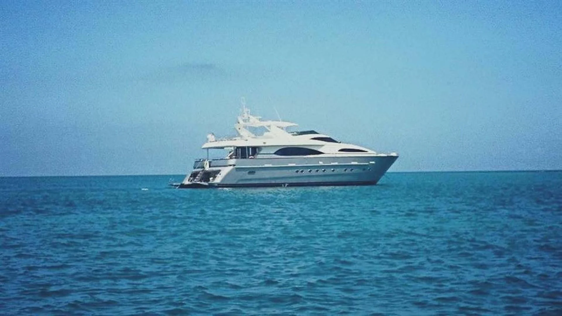 a white yacht in the water aboard EL CAPRICHO Yacht for Sale