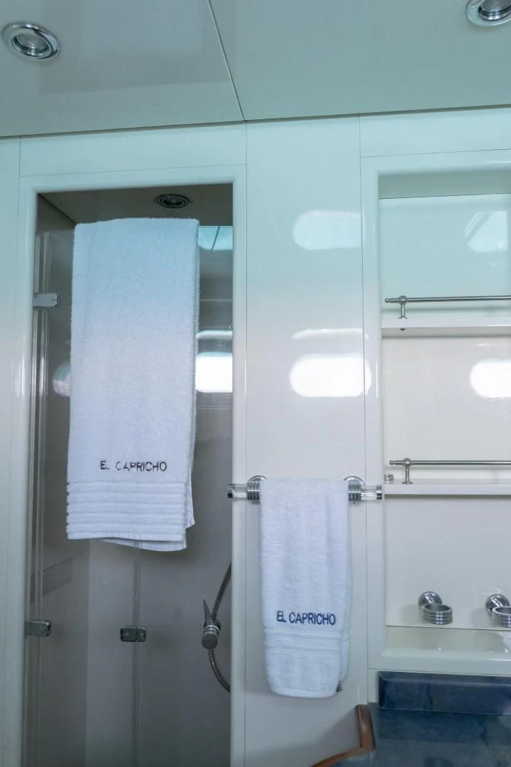 a shower with a towel on the wall aboard EL CAPRICHO Yacht for Sale