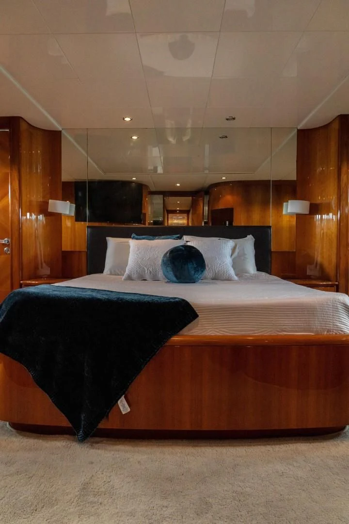 a bed with a black sheet aboard EL CAPRICHO Yacht for Sale