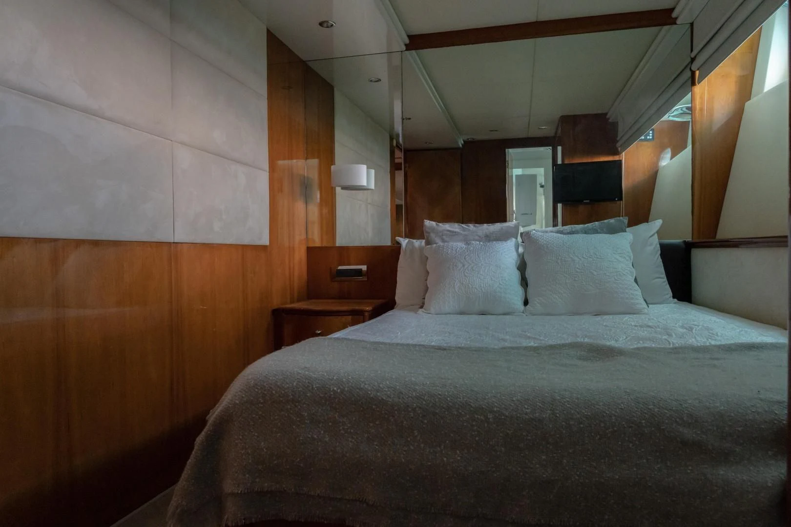a bed with pillows aboard EL CAPRICHO Yacht for Sale