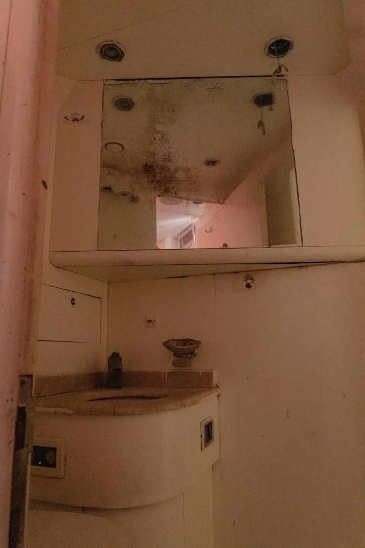a sink with a mirror on the wall aboard EL CAPRICHO Yacht for Sale