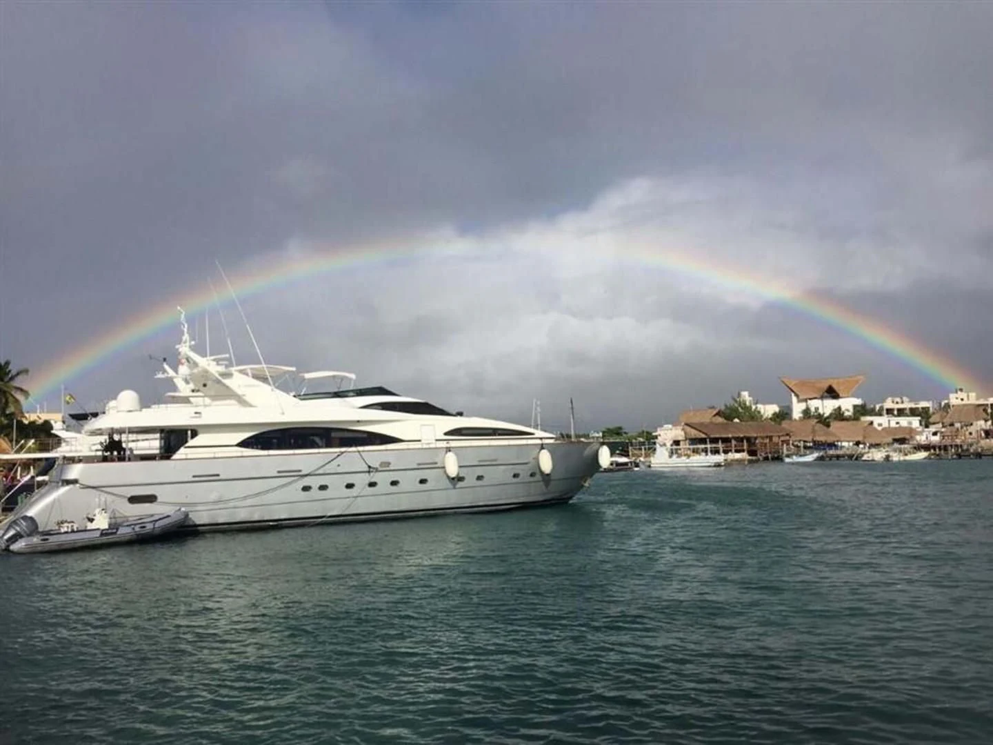 a rainbow over a boat in the water aboard EL CAPRICHO Yacht for Sale