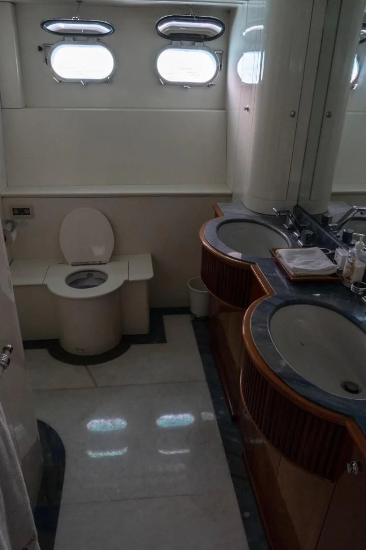a bathroom with a sink and toilet aboard EL CAPRICHO Yacht for Sale