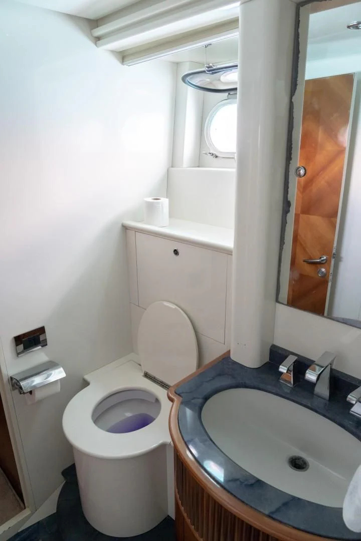 a bathroom with a sink and a toilet aboard EL CAPRICHO Yacht for Sale