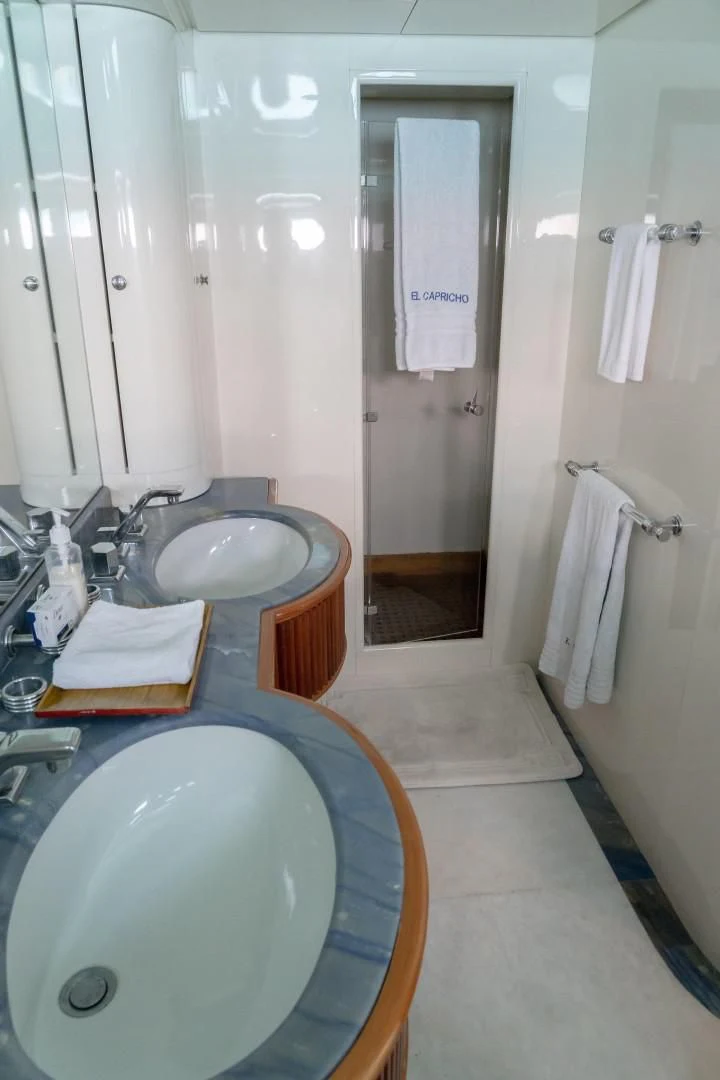a bathroom with a sink and a mirror aboard EL CAPRICHO Yacht for Sale