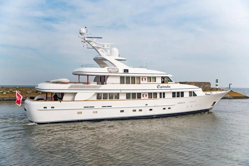 a large white boat in the water aboard CIPITOUBA Yacht for Sale