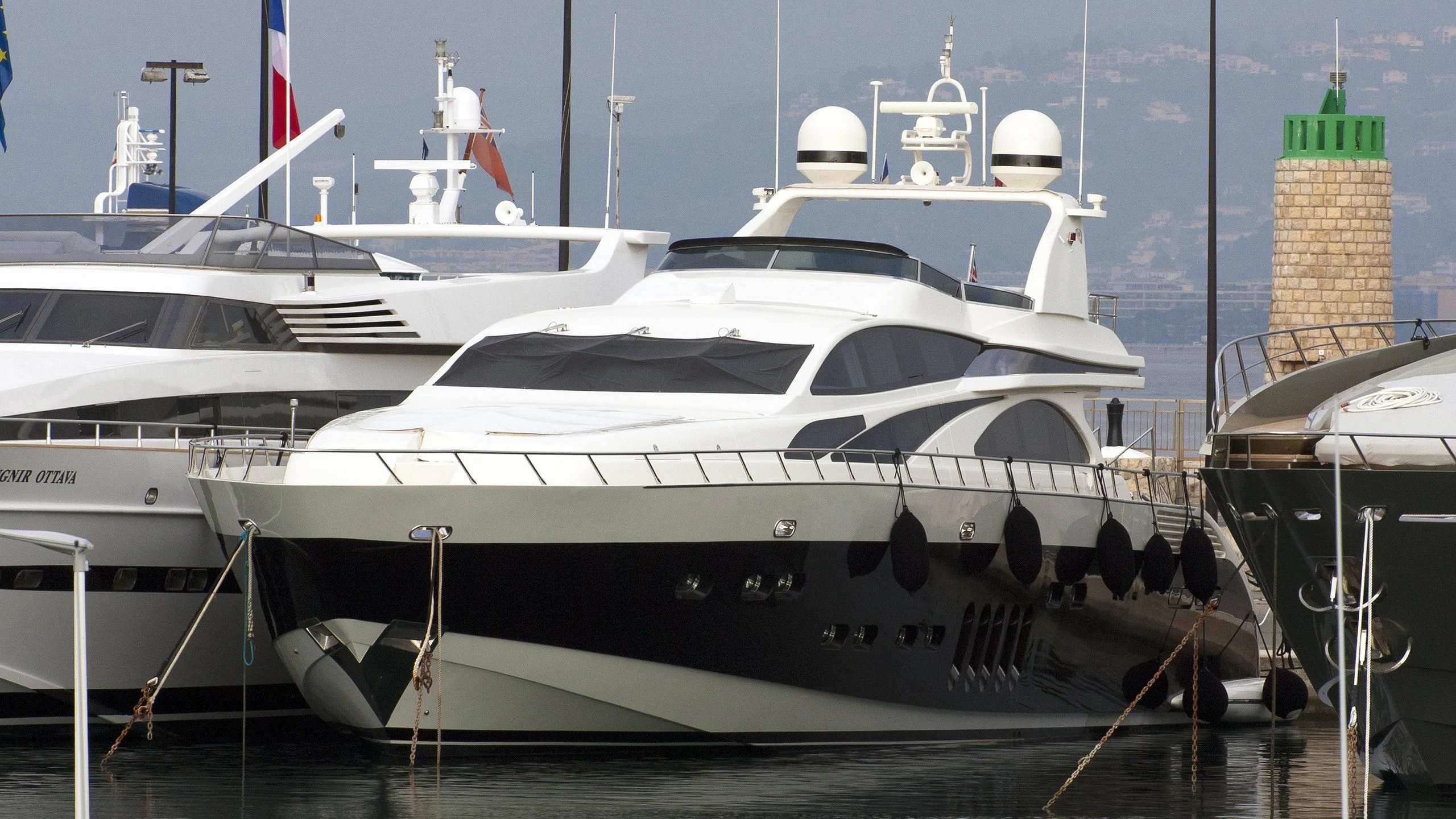 a white yacht in the water aboard GLOW Yacht for Sale