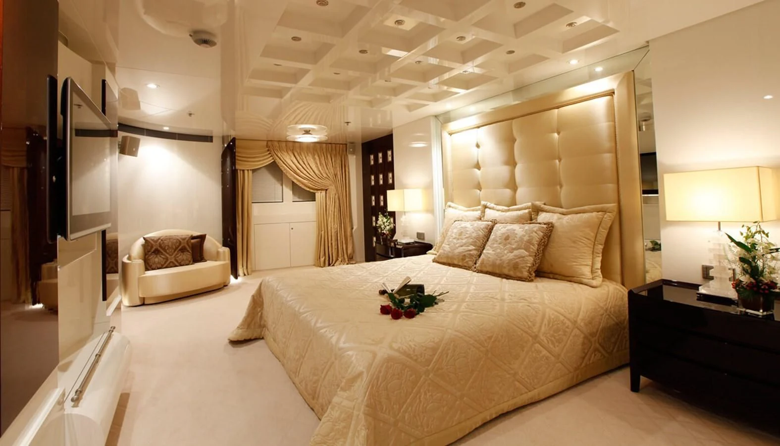 a large bedroom with a large bed aboard VERA Yacht for Sale