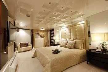 a large bedroom with a large bed aboard VERA Yacht for Sale