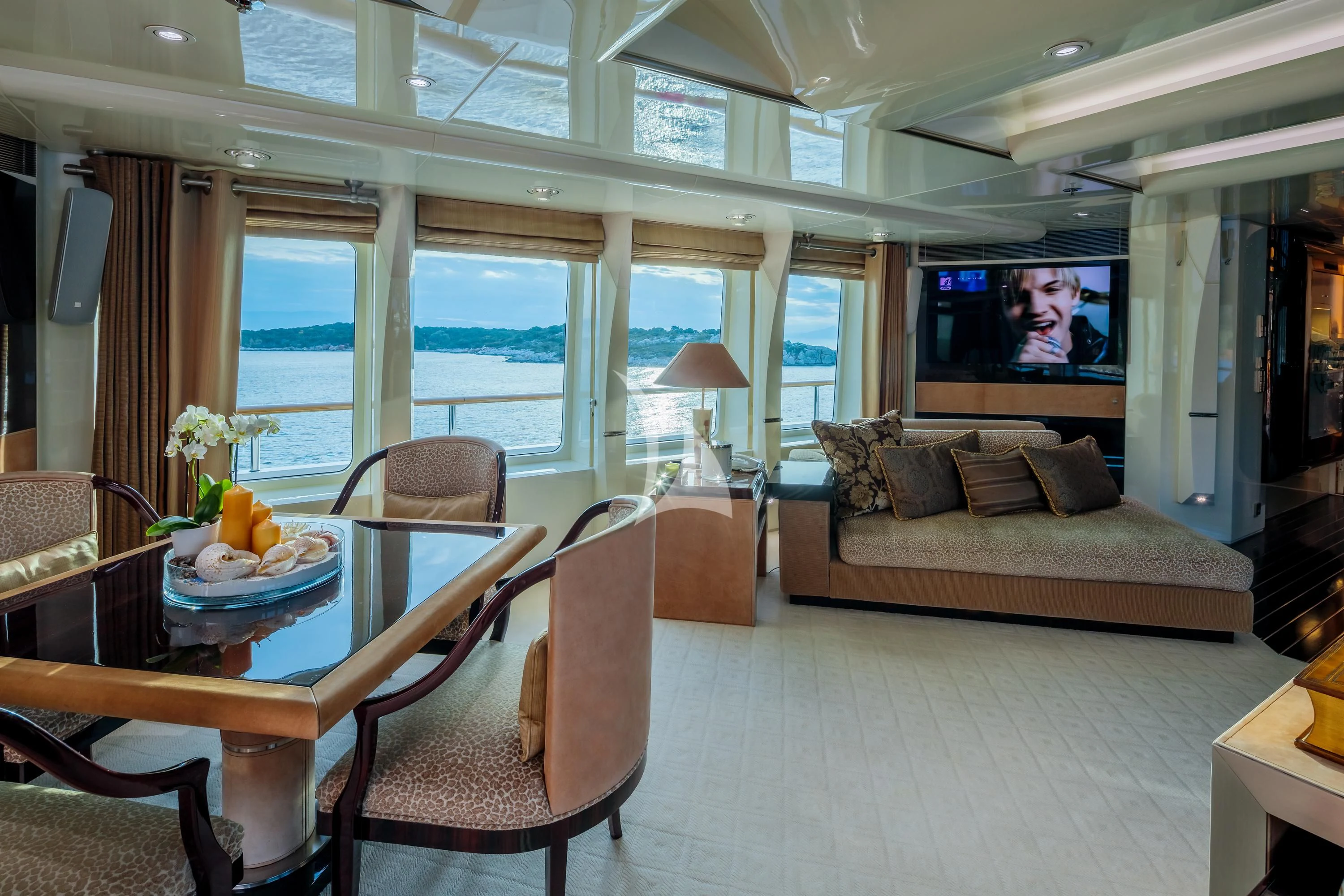 a living room with a couch and a television aboard VERA Yacht for Sale