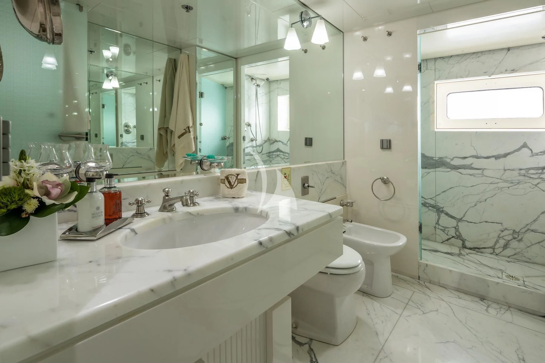 a bathroom with a large mirror aboard VERA Yacht for Sale