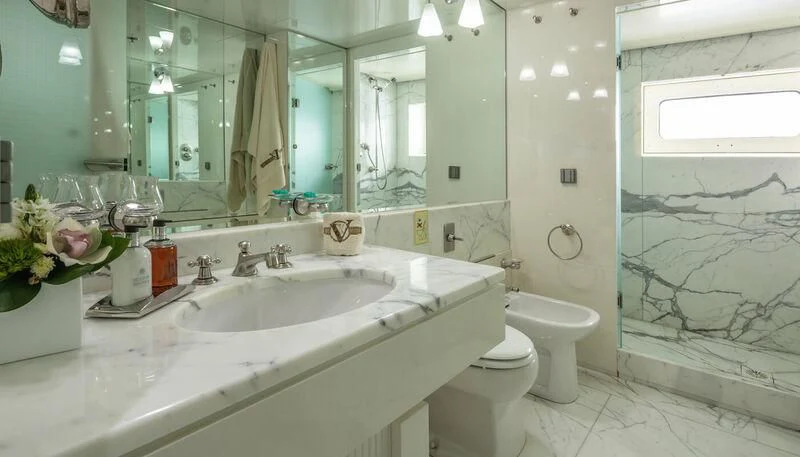 a bathroom with a large mirror aboard VERA Yacht for Sale