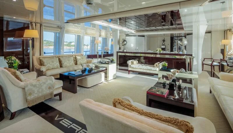 a living room with a piano and a couch aboard VERA Yacht for Sale