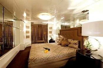 a bedroom with a bed and a dog aboard VERA Yacht for Sale