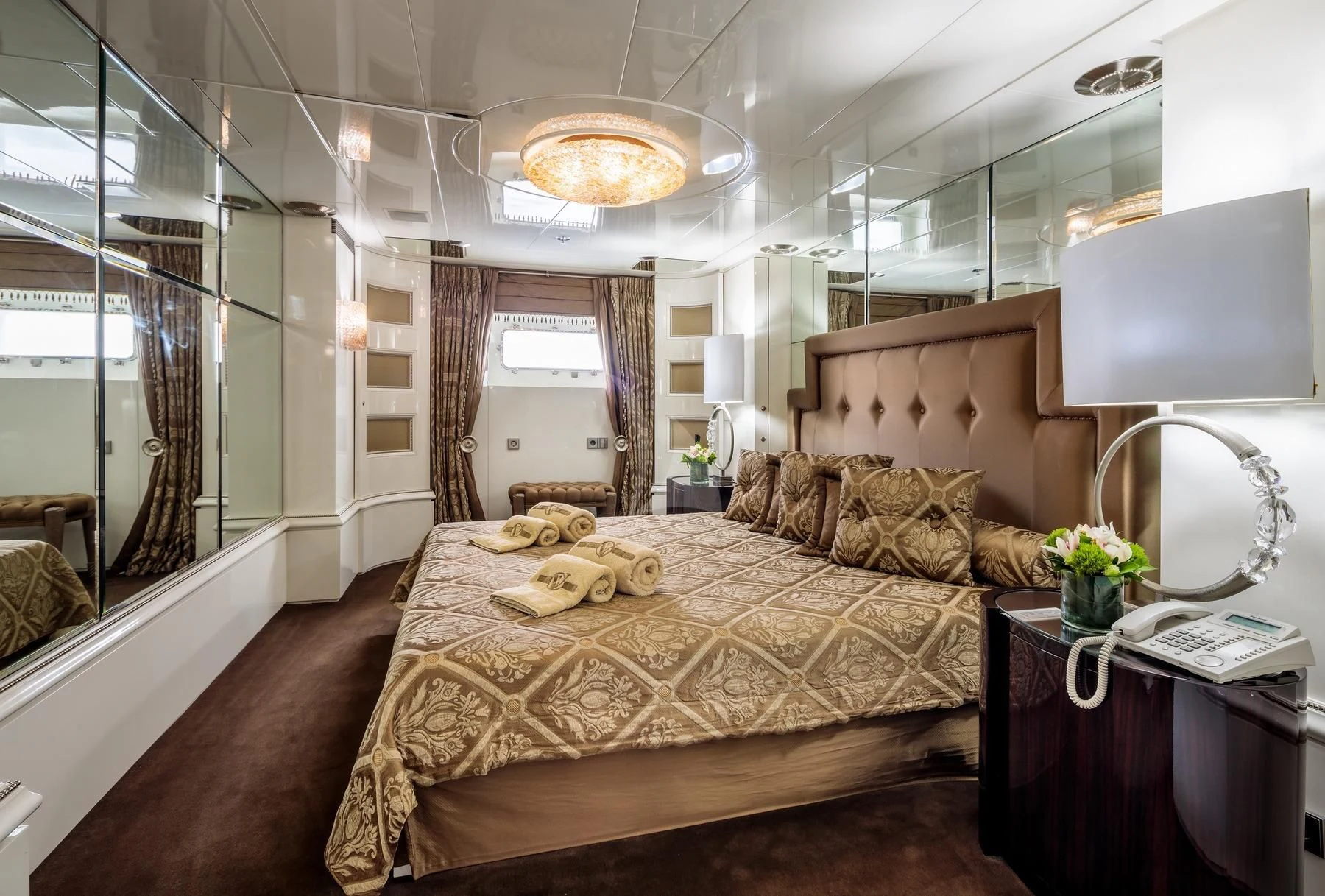 a large bed in a room aboard VERA Yacht for Sale