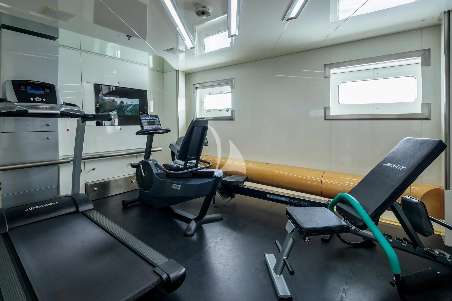 a room with treadmills and a computer aboard VERA Yacht for Sale