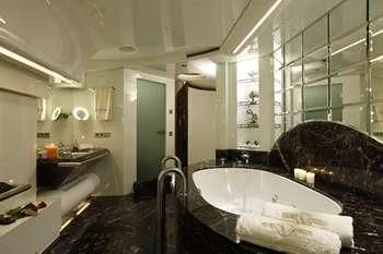 a bathroom with a bathtub and a sink aboard VERA Yacht for Sale