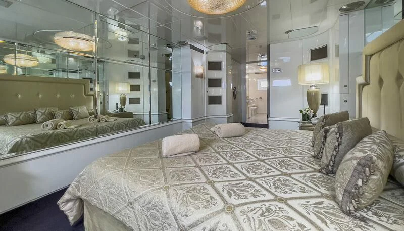a large bed in a room aboard VERA Yacht for Sale