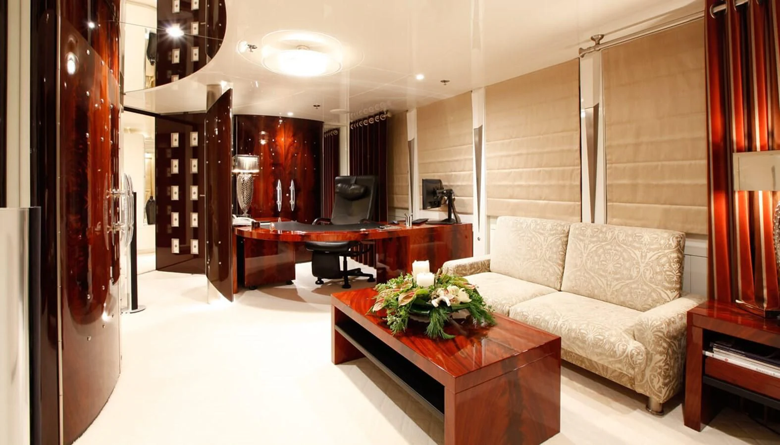 a living room with a couch and a table aboard VERA Yacht for Sale