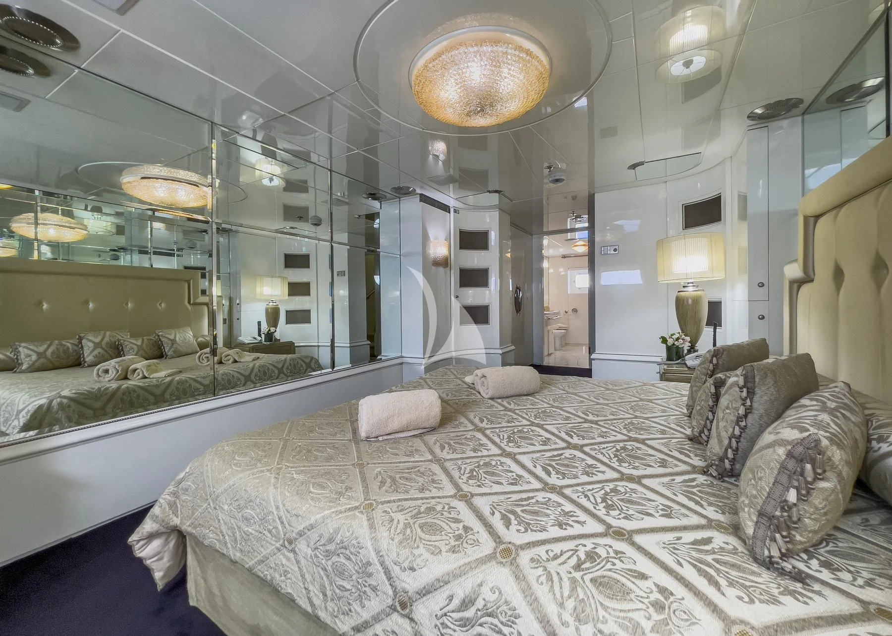 a large bedroom with a large bed aboard VERA Yacht for Sale