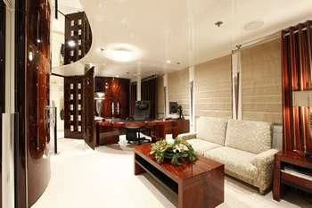 a living room with a white couch aboard VERA Yacht for Sale