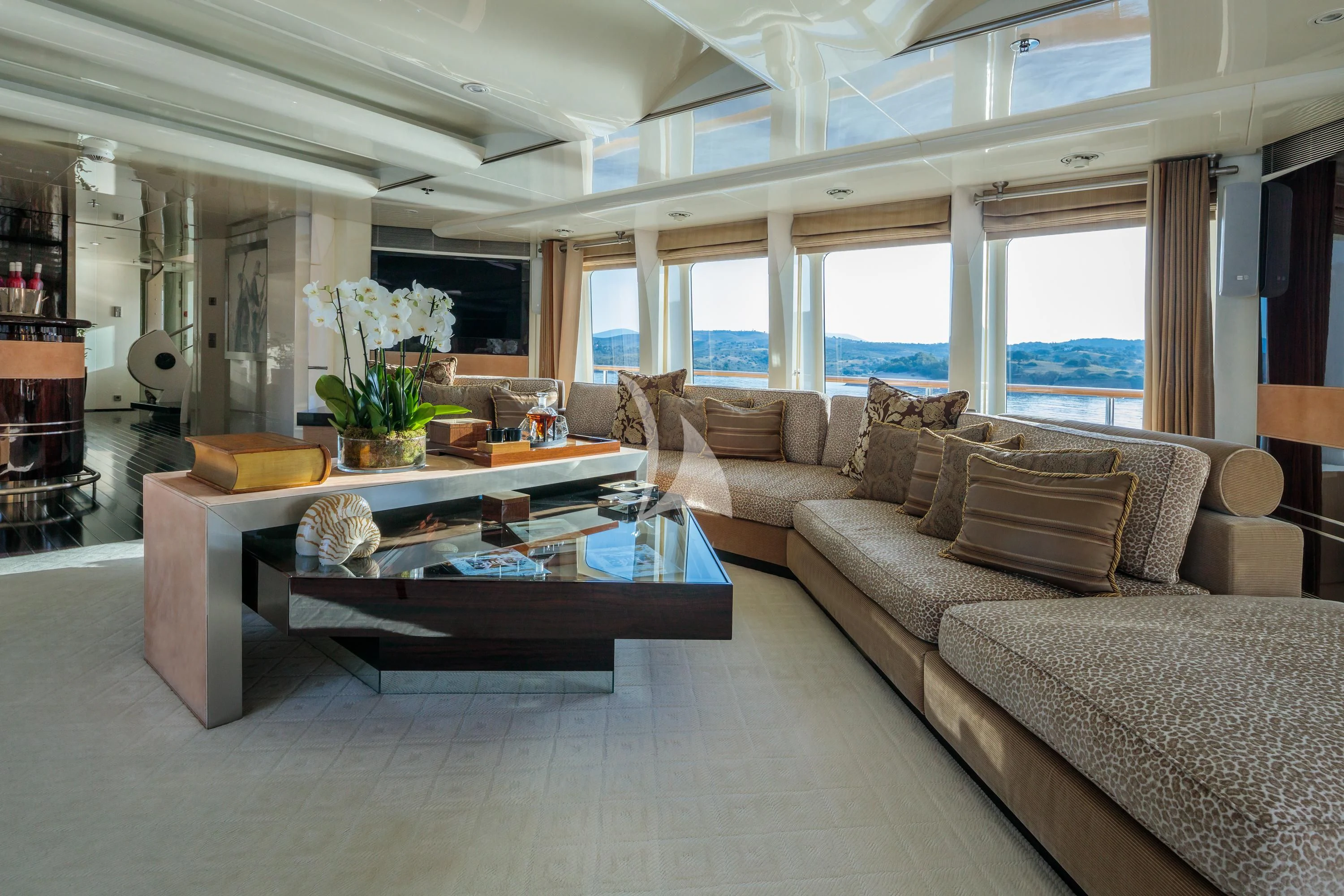 a living room with a couch and a coffee table aboard VERA Yacht for Sale
