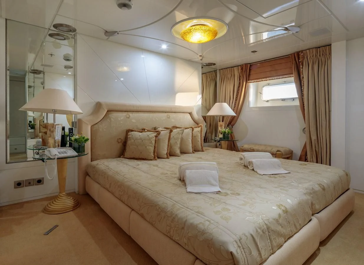 a large bed in a hotel room aboard VERA Yacht for Sale