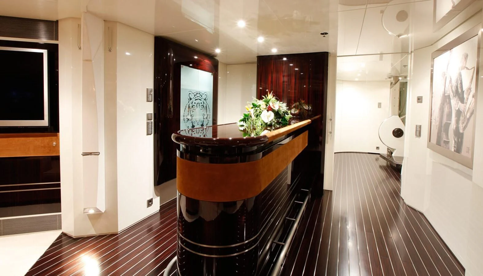 a hallway with a wood table and white doors aboard VERA Yacht for Sale