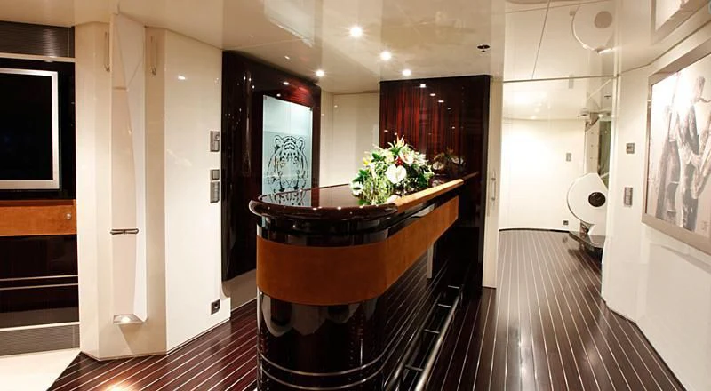 a room with a wood table and a large mirror aboard VERA Yacht for Sale