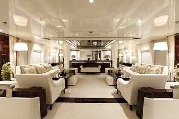 a large living room with white furniture aboard VERA Yacht for Sale