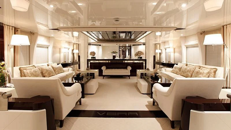 a large living room with a piano aboard VERA Yacht for Sale
