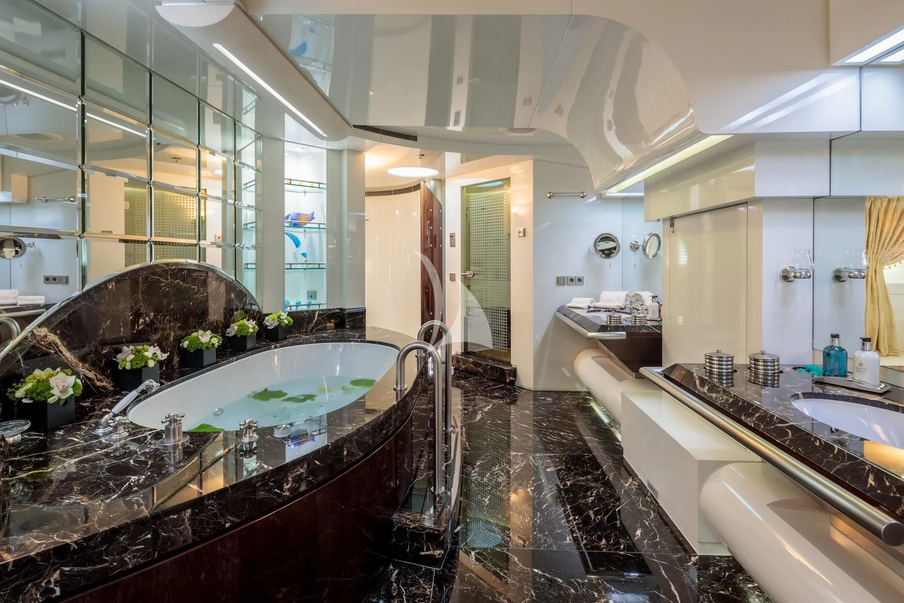 a large bathroom with a large marble countertop aboard VERA Yacht for Sale