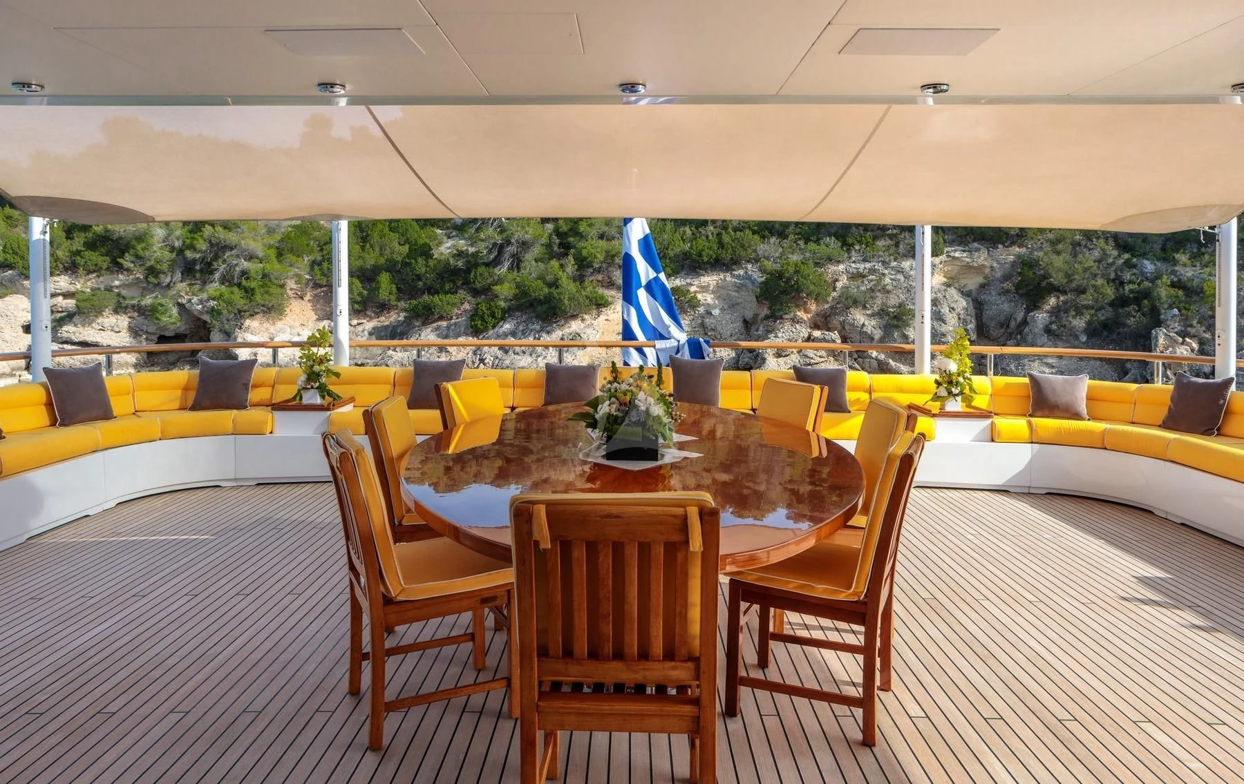a table and chairs in a room aboard VERA Yacht for Sale