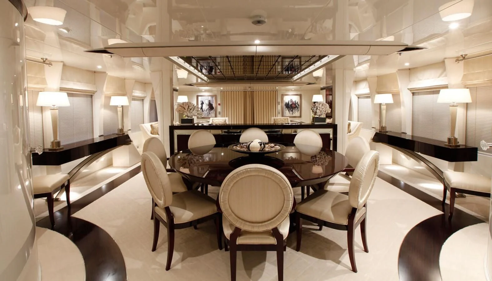 a large room with a table and chairs aboard VERA Yacht for Sale