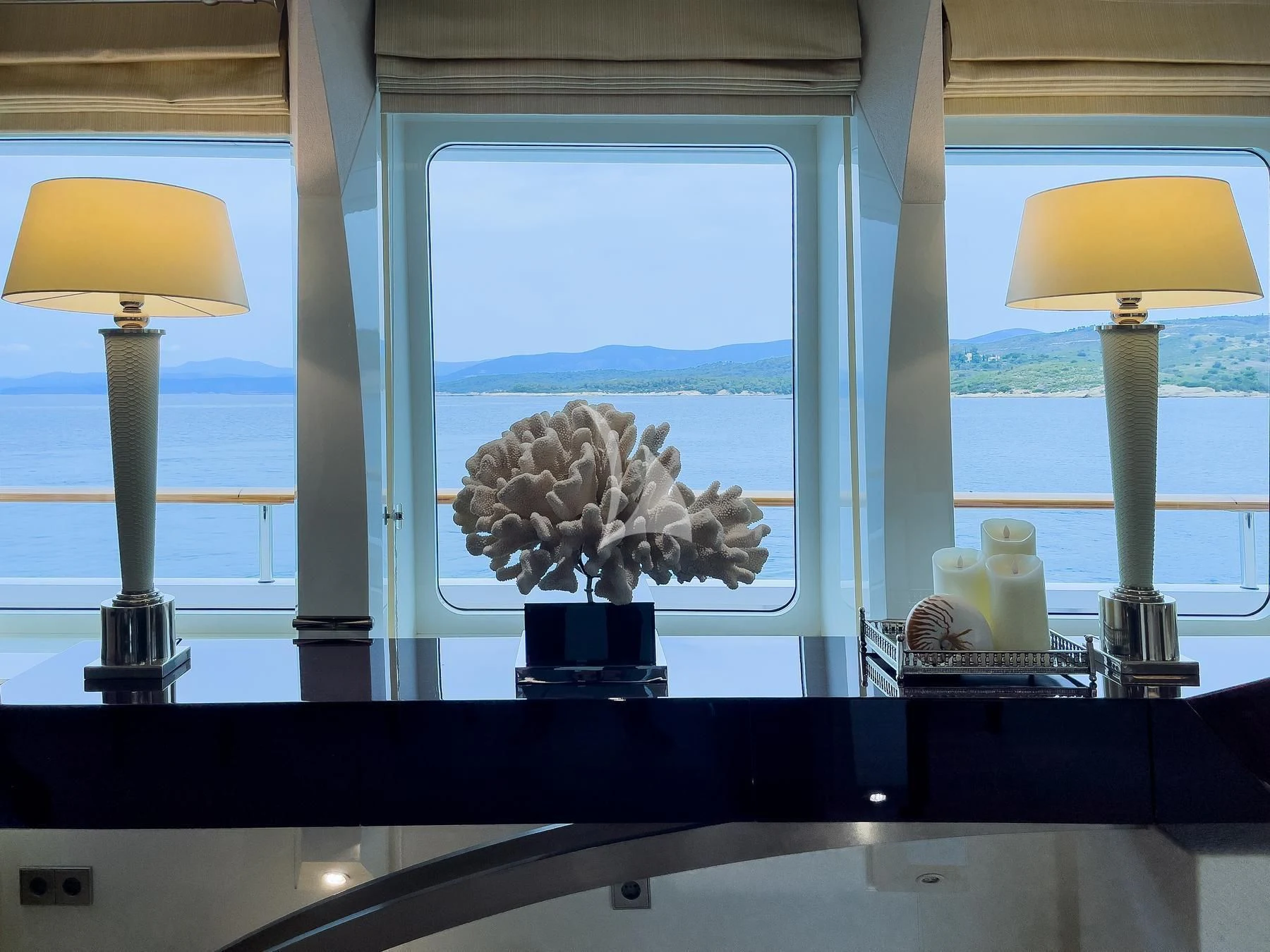 a window with a vase of flowers aboard VERA Yacht for Sale