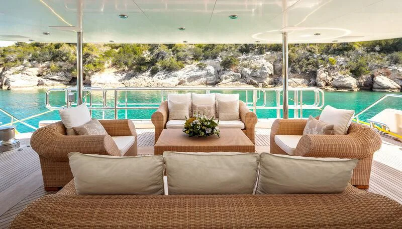 a room with couches and a view of a city aboard VERA Yacht for Sale